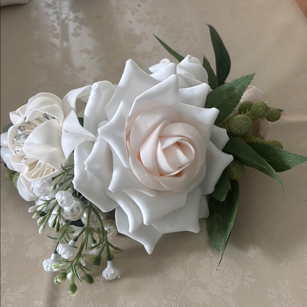 Lings moments 3- wrist corsages in pink and mauve & 1 larger wrist corsage ivory